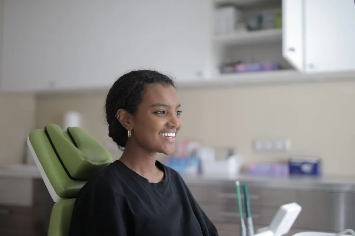 A relaxed patient smiling in the dental chair